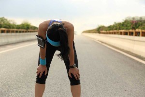 bigstock-tired-woman-runner-taking-a-re-93403139